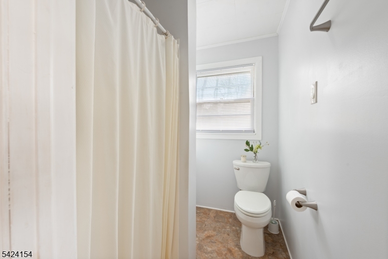 41 Swartswood Road Newton, NJ 07860 - Photo 15 of 22 a white toilet sitting next to a shower curtain