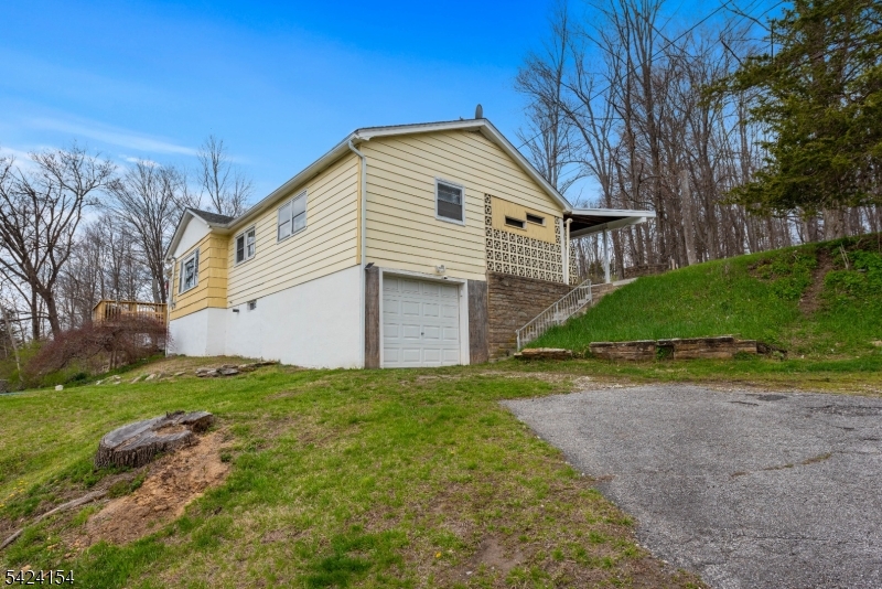 41 Swartswood Road Newton, NJ 07860 - Photo 20 of 22 a front view of a house with a yard and garage
