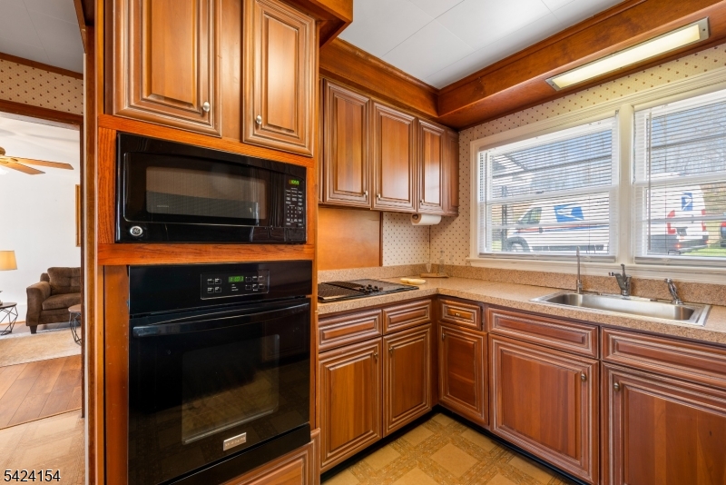 41 Swartswood Road Newton, NJ 07860 - Photo 6 of 22 a kitchen with stainless steel appliances granite countertop a stove microwave and sink