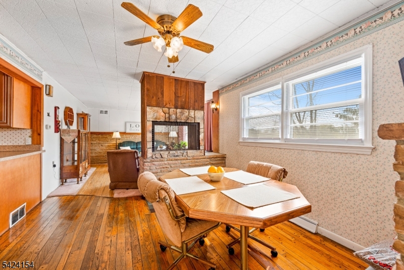 41 Swartswood Road Newton, NJ 07860 - Photo 9 of 22 a living room with furniture a chandelier and a dining table