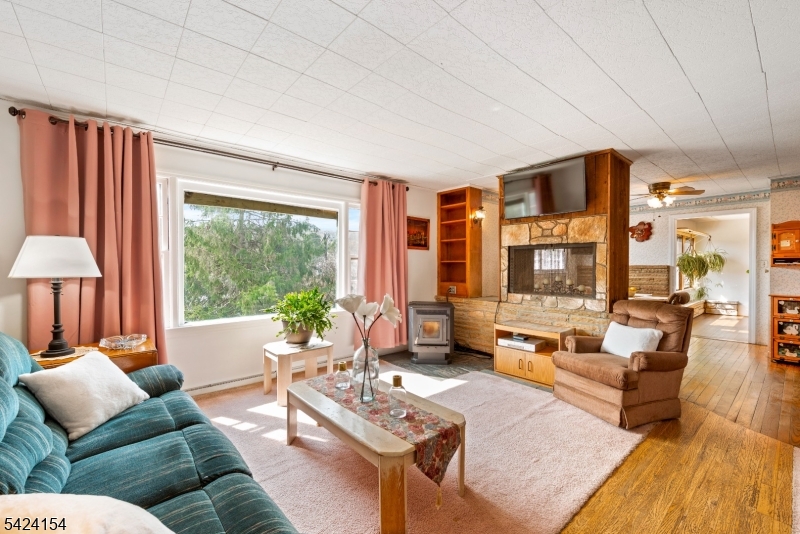 41 Swartswood Road Newton, NJ 07860 - Photo 10 of 22 a living room with furniture and a large window