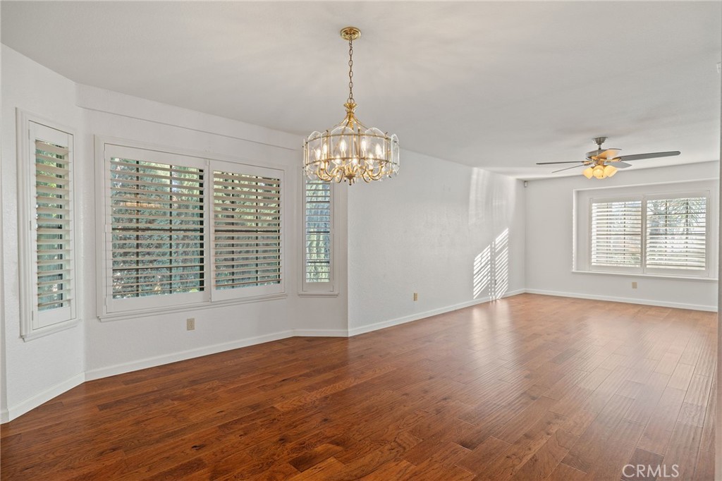 11030 Vicksburg Court Rancho Cucamonga, CA 91737 - Photo 11 of 53 a view of an empty room with wooden floor and a window