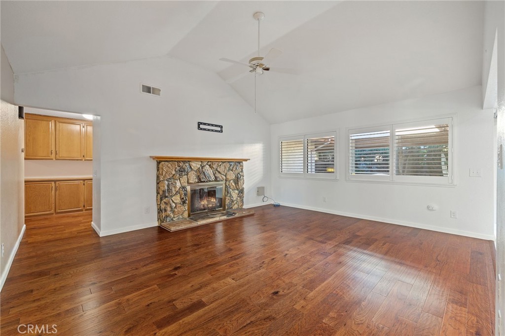 11030 Vicksburg Court Rancho Cucamonga, CA 91737 - Photo 12 of 53 an empty room with wooden floor and windows