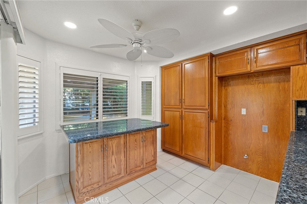 11030 Vicksburg Court Rancho Cucamonga, CA 91737 - Photo 19 of 53 a view of a bathroom with a shower and a sink