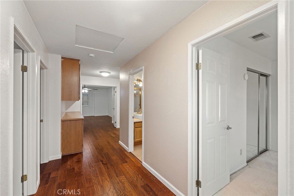 11030 Vicksburg Court Rancho Cucamonga, CA 91737 - Photo 23 of 53 a view of hallway with wooden floor
