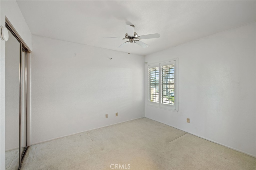 11030 Vicksburg Court Rancho Cucamonga, CA 91737 - Photo 25 of 53 an empty room with a window and ceiling fan