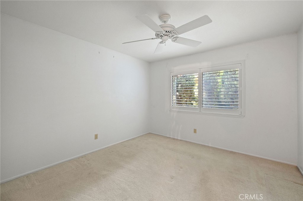 11030 Vicksburg Court Rancho Cucamonga, CA 91737 - Photo 29 of 53 an empty room with windows and fan