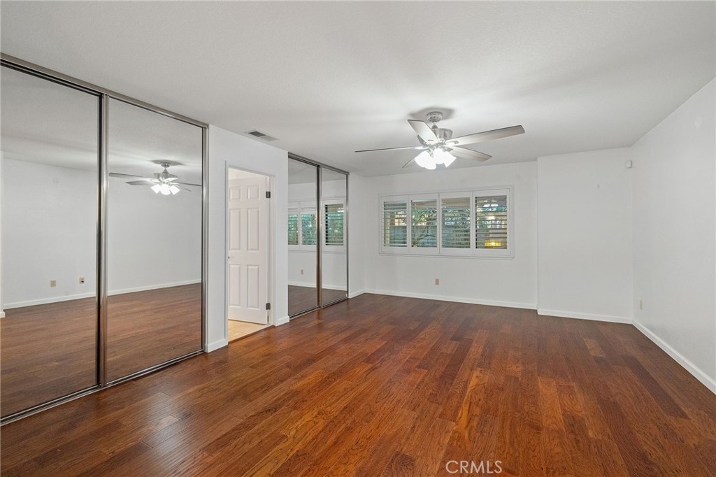 11030 Vicksburg Court Rancho Cucamonga, CA 91737 - Photo 33 of 53 a view of an empty room with a window and wooden floor