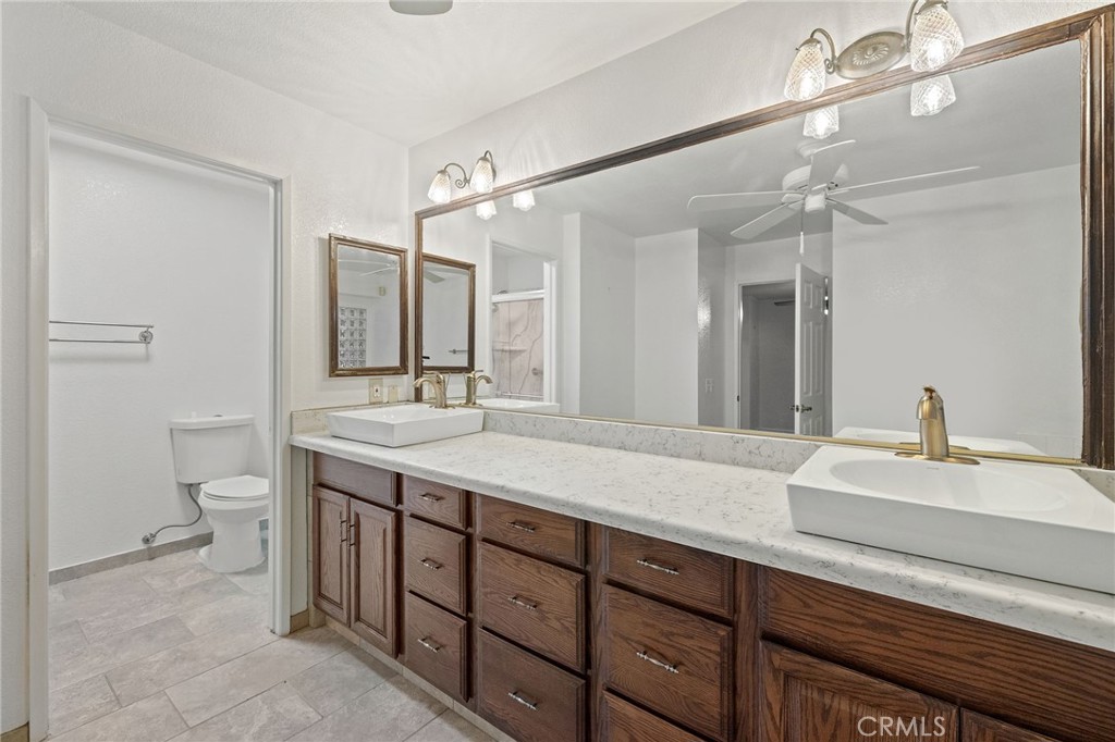 11030 Vicksburg Court Rancho Cucamonga, CA 91737 - Photo 38 of 53 a bathroom with a sink double vanity and a mirror
