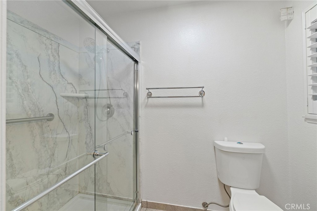 11030 Vicksburg Court Rancho Cucamonga, CA 91737 - Photo 39 of 53 a bathroom with a toilet and a shower