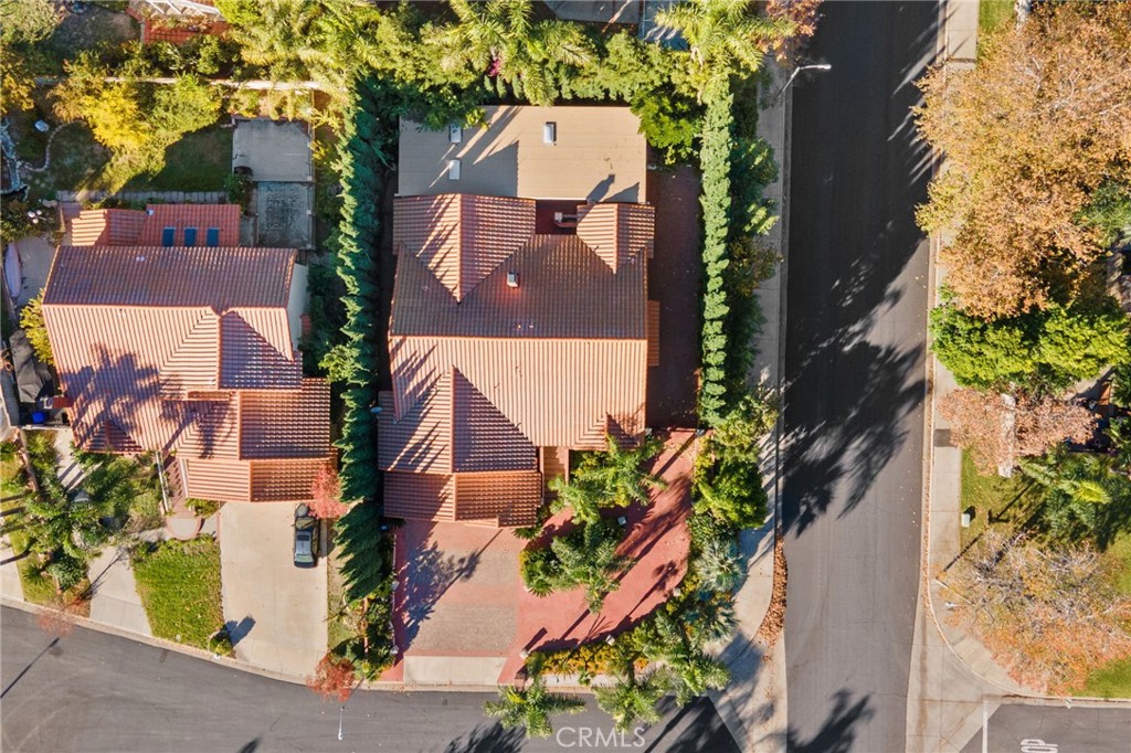 11030 Vicksburg Court Rancho Cucamonga, CA 91737 - Photo 43 of 53 an aerial view of a house with a yard and garden