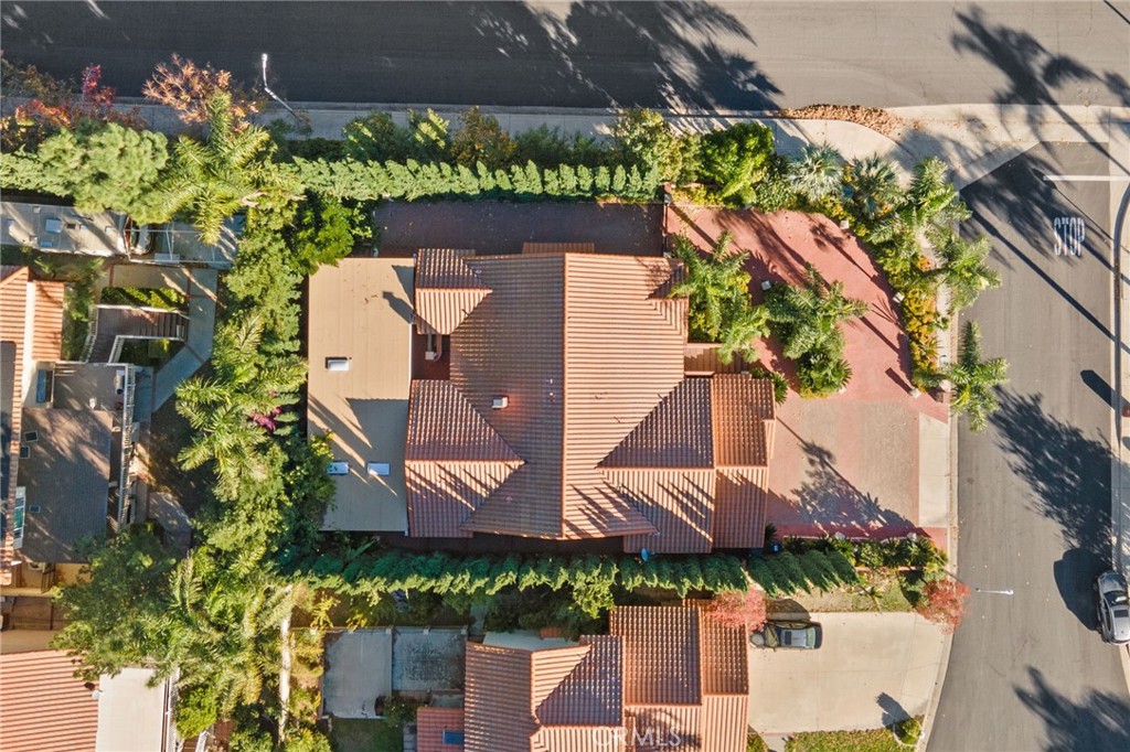11030 Vicksburg Court Rancho Cucamonga, CA 91737 - Photo 46 of 53 an aerial view of a house with a yard and garden