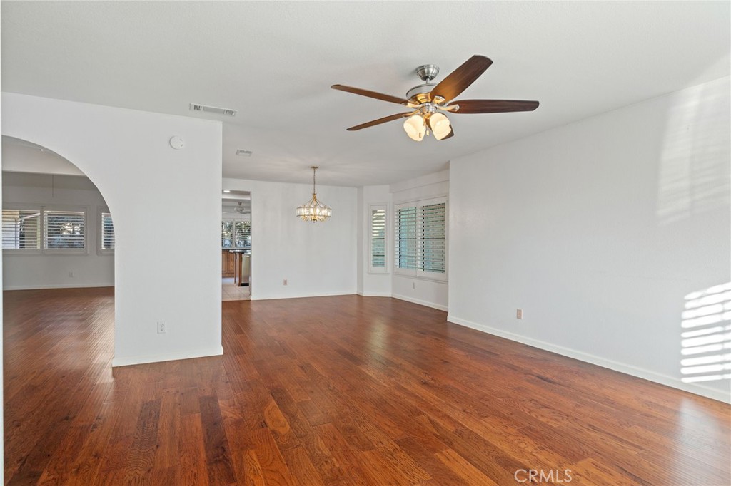 11030 Vicksburg Court Rancho Cucamonga, CA 91737 - Photo 8 of 53 a view of empty room with wooden floor and ceiling fan