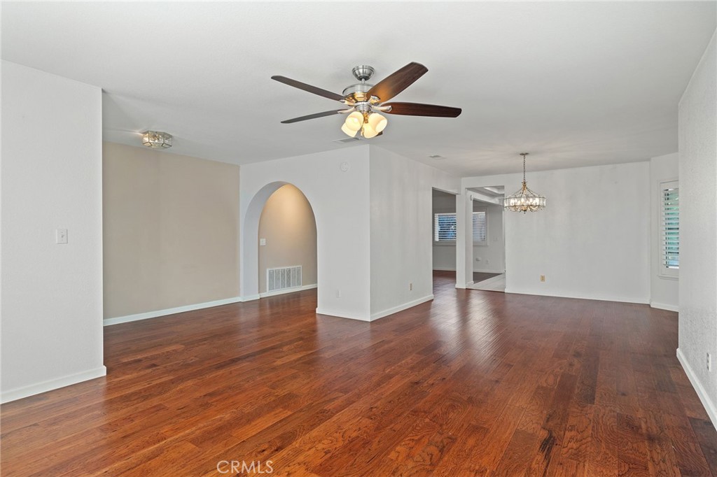 11030 Vicksburg Court Rancho Cucamonga, CA 91737 - Photo 9 of 53 a view of a livingroom with a hardwood floor and a ceiling fan
