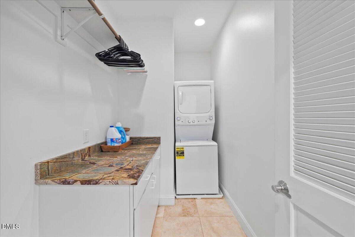 1304 Flying Hawk Road Apex, NC 27523 - Photo 27 of 52 a bathroom with a granite countertop sink and a mirror