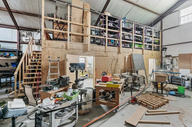 a view of a kitchen with utility room and sink