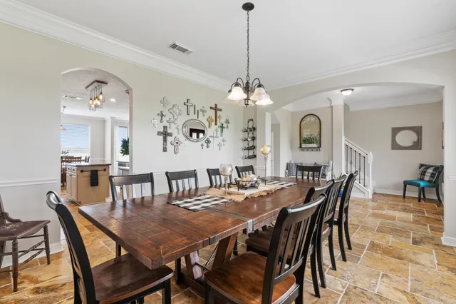 a kitchen with granite countertop stainless steel appliances a stove cabinets and microwave