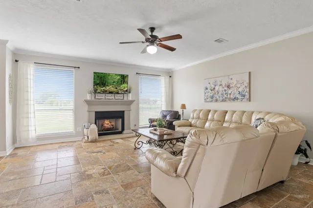 a spacious bedroom with a bed and a window