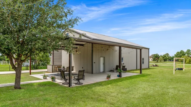 a view of a backyard with sitting area