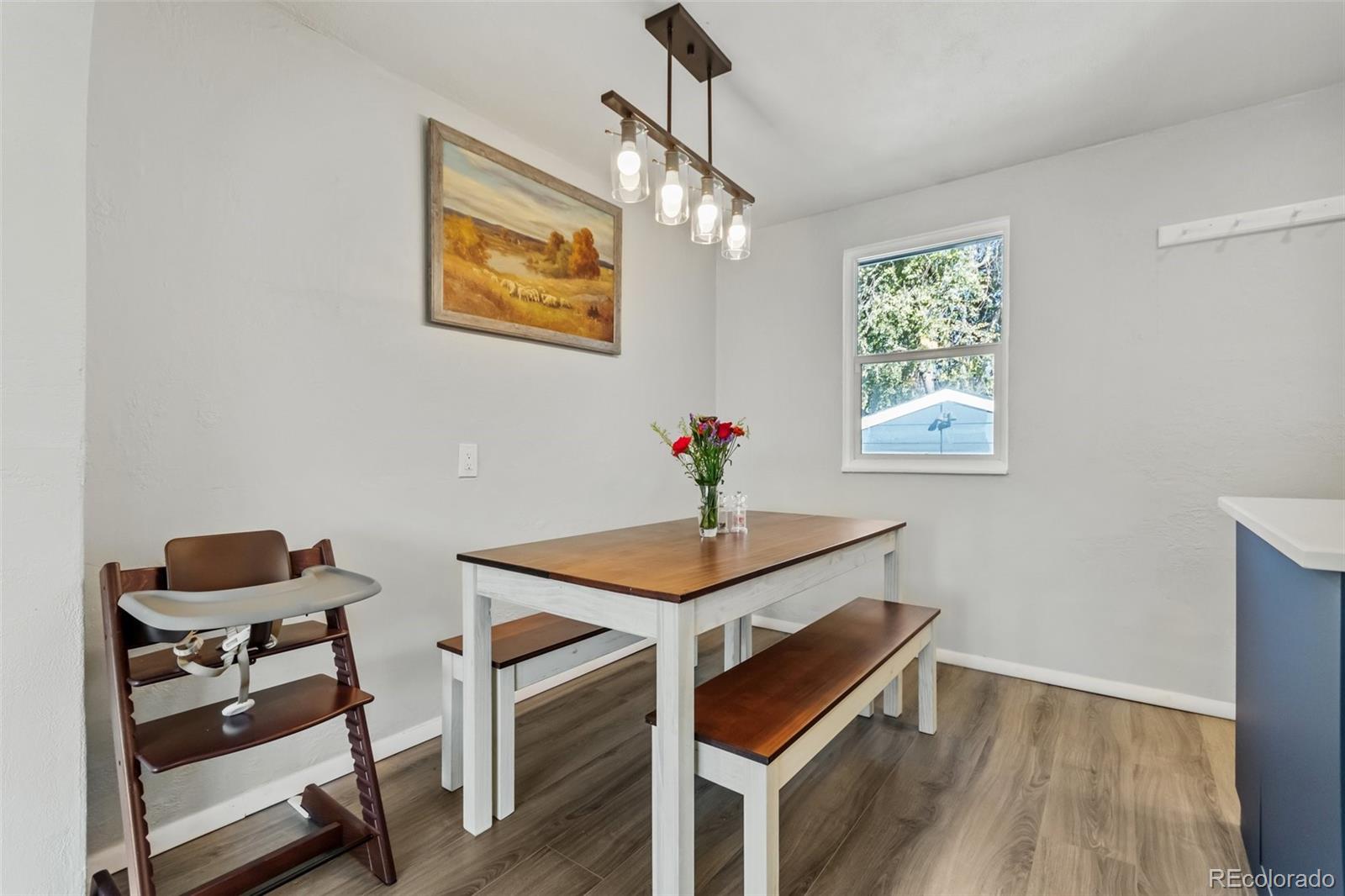 13436 Fitzsimons Way Aurora, CO 80011 - Photo 15 of 40 a dining room with furniture and window