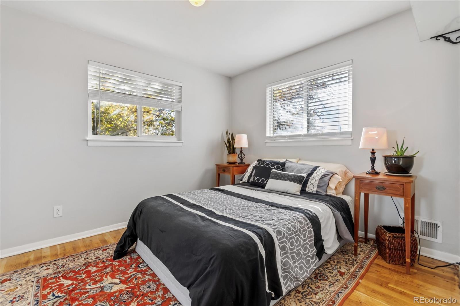 13436 Fitzsimons Way Aurora, CO 80011 - Photo 25 of 40 a bed sitting in a bedroom next to a window