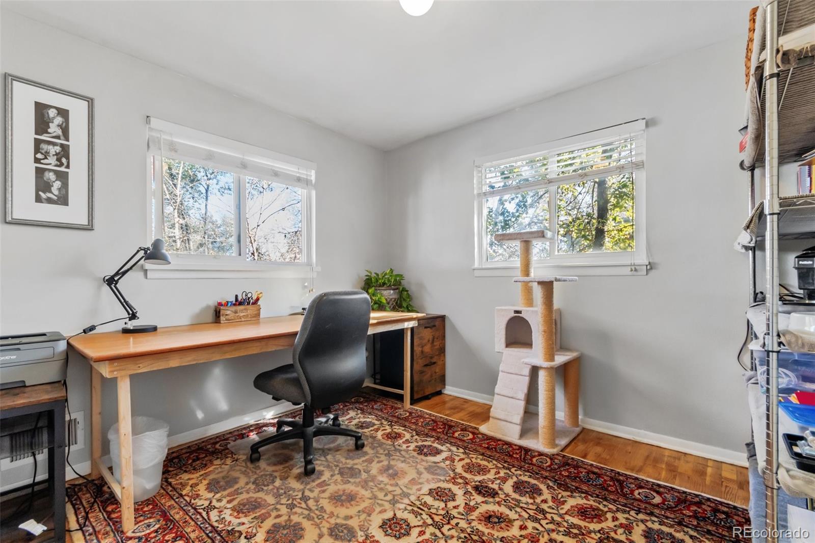 13436 Fitzsimons Way Aurora, CO 80011 - Photo 27 of 40 a view of a workspace with furniture and a window