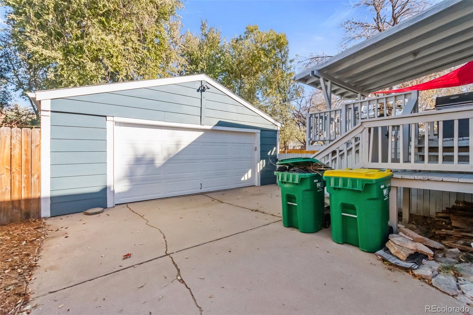 13436 Fitzsimons Way Aurora, CO 80011 - Photo 4 of 40 a backyard of a house with oven a barbeque and outdoor seating