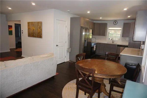 a view of a dining room with furniture and wooden floor