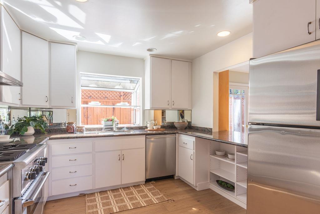 3455 Dover Road Redwood City, CA 94061 - Photo 15 of 39 a kitchen with granite countertop a sink and cabinets