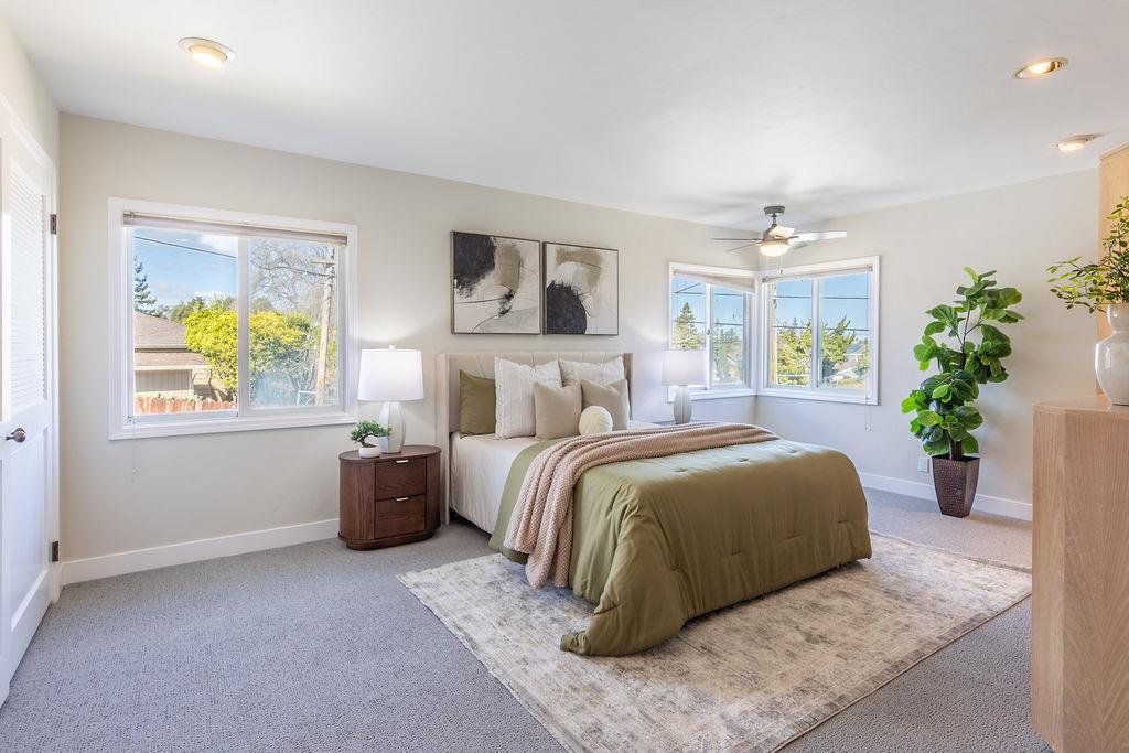 3455 Dover Road Redwood City, CA 94061 - Photo 18 of 39 a bedroom with a bed painting on wall and a potted plant