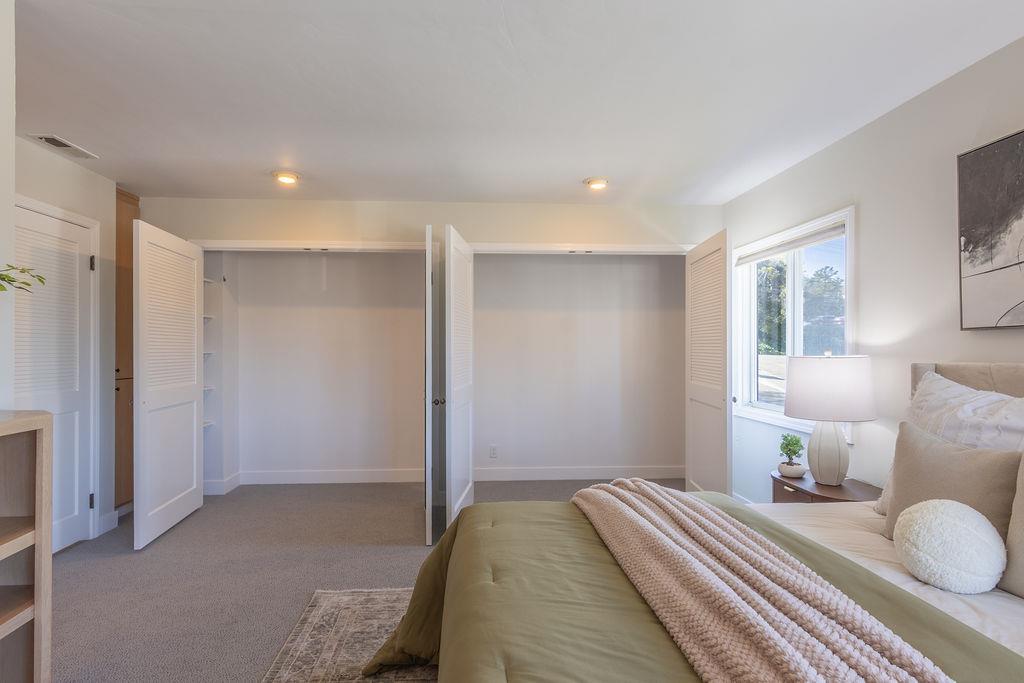 3455 Dover Road Redwood City, CA 94061 - Photo 21 of 39 a bedroom with a bed and a painting on the wall
