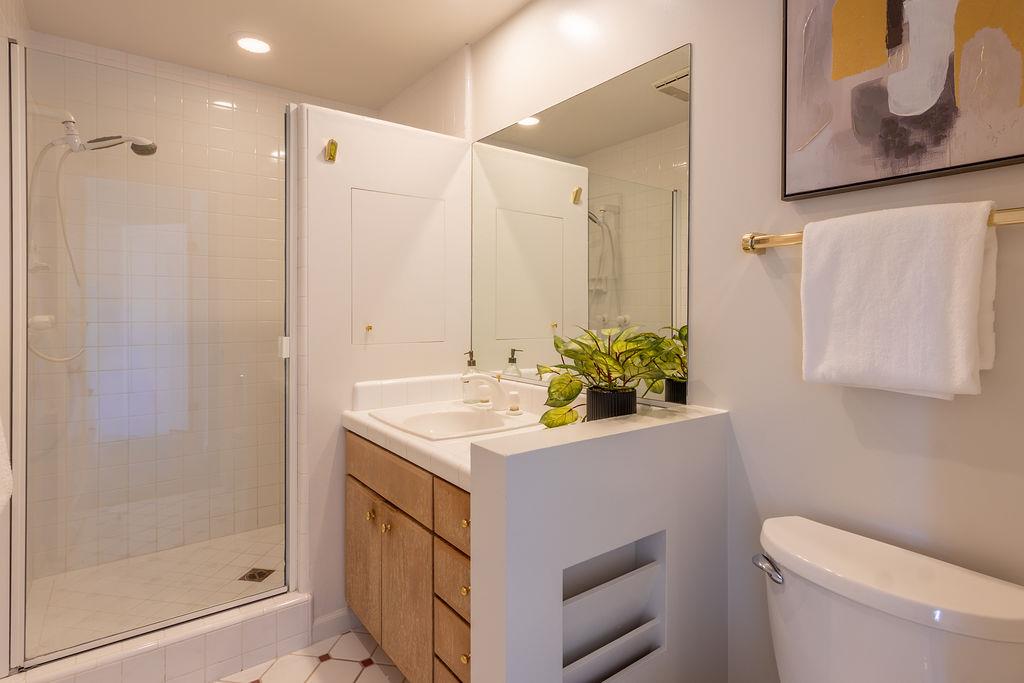 3455 Dover Road Redwood City, CA 94061 - Photo 23 of 39 a bathroom with a sink a toilet and shower
