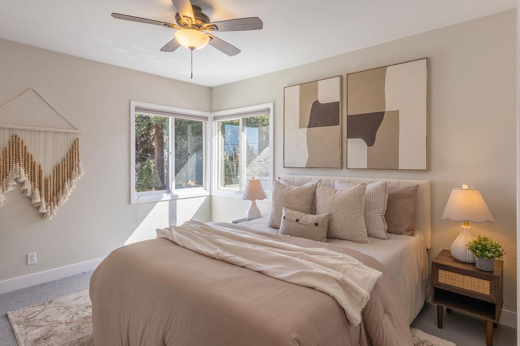3455 Dover Road Redwood City, CA 94061 - Photo 24 of 39 a bedroom with a bed and a chandelier