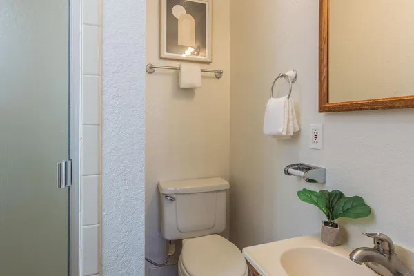 a bathroom with a shower and a sink