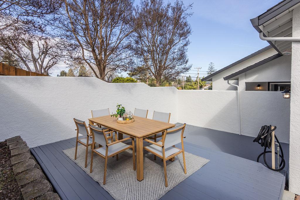 3455 Dover Road Redwood City, CA 94061 - Photo 35 of 39 a view of a house with a table and chairs in patio