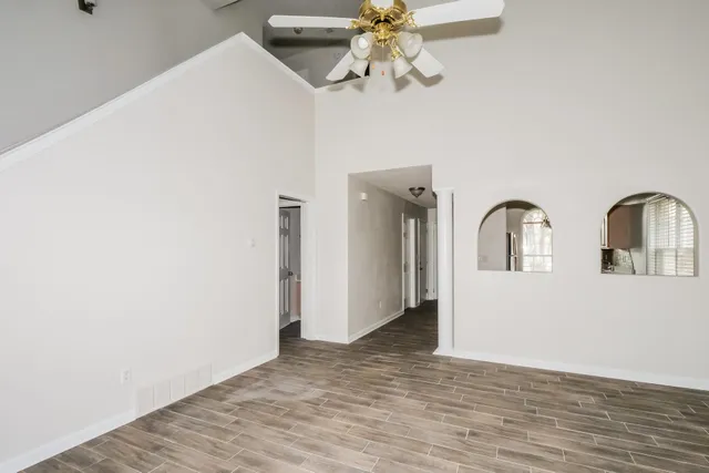 a view of an entryway with wooden floor