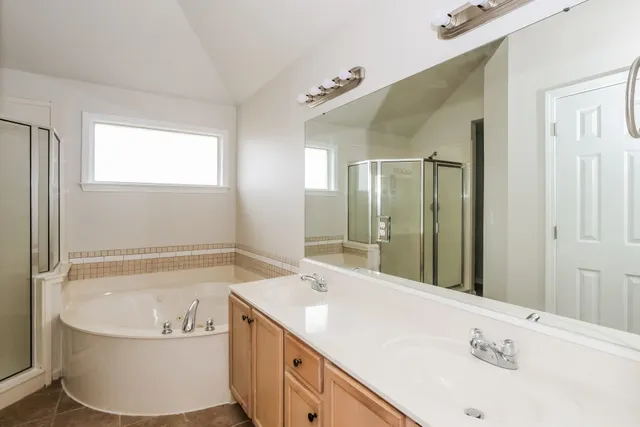a bathroom with a bathtub and a sink