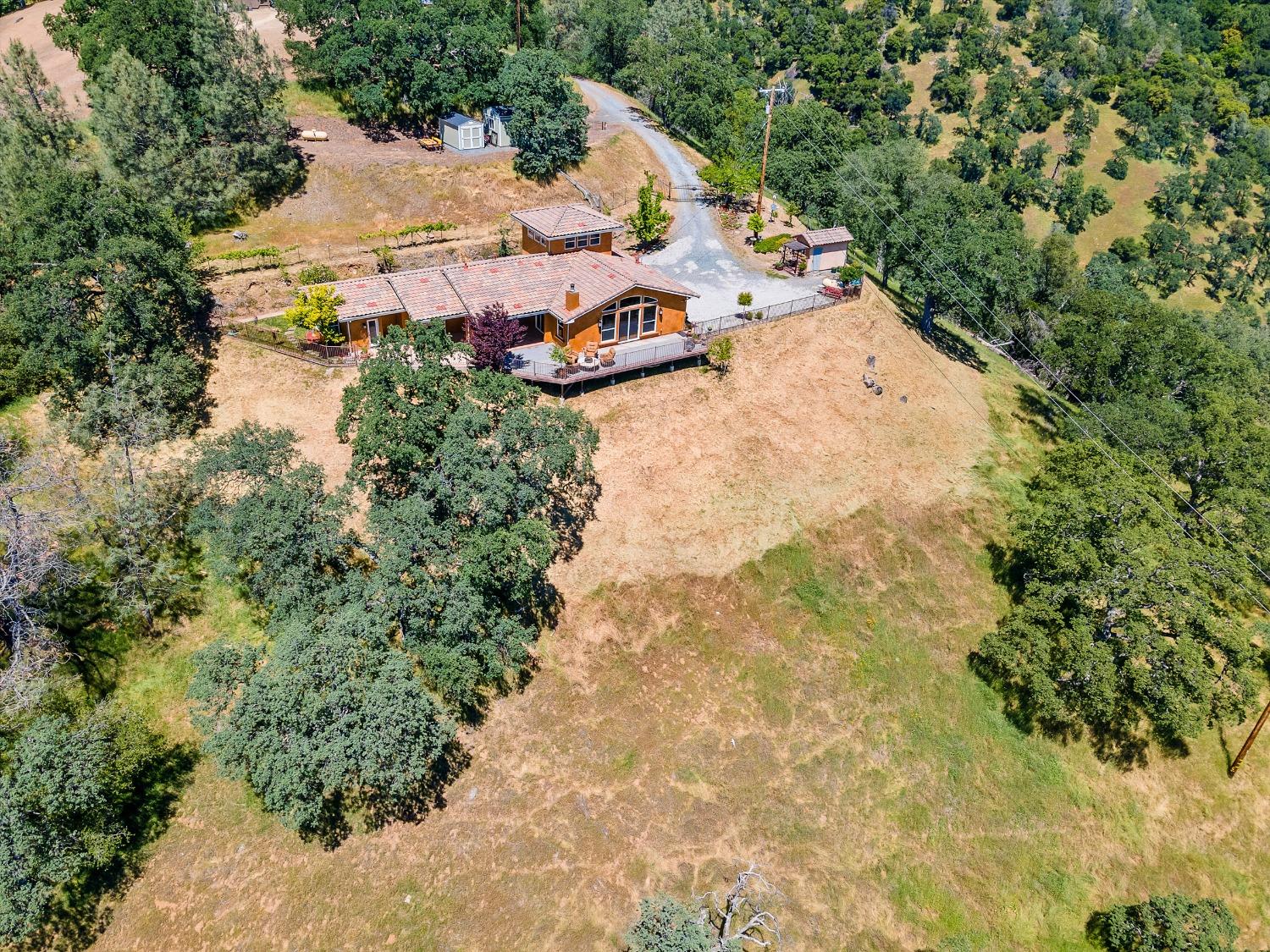 6801 Sagittarius Road Placerville, CA 95667 - Photo 18 of 34 an aerial view of a house with a yard and large trees