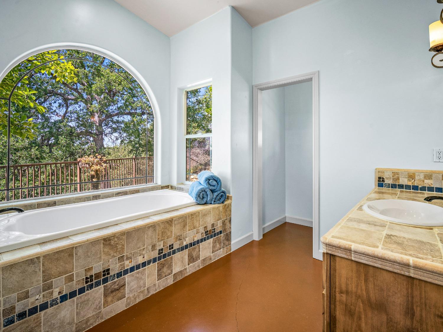6801 Sagittarius Road Placerville, CA 95667 - Photo 23 of 34 a spacious bedroom with a bed and a window