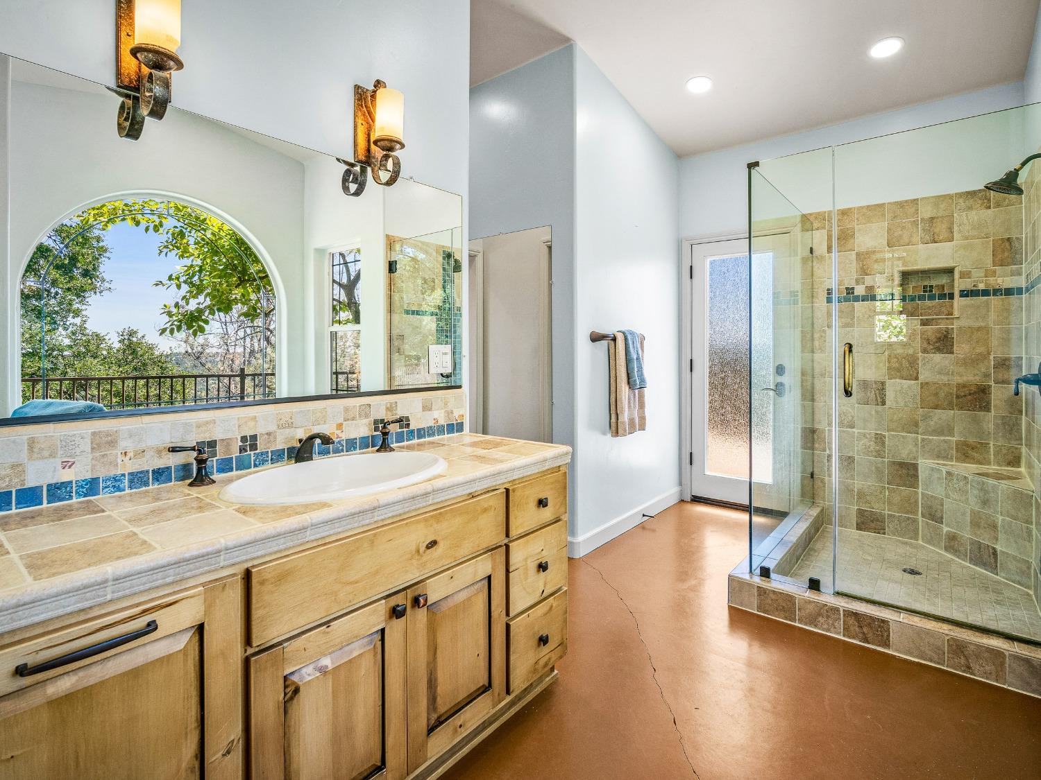 6801 Sagittarius Road Placerville, CA 95667 - Photo 25 of 34 a spacious bathroom with a double vanity sink a mirror and a shower