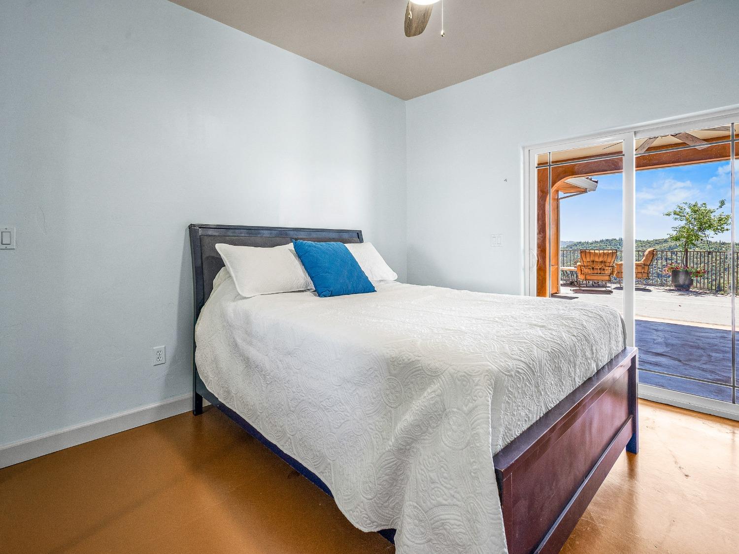 6801 Sagittarius Road Placerville, CA 95667 - Photo 26 of 34 a large bed sitting in a bedroom next to a window