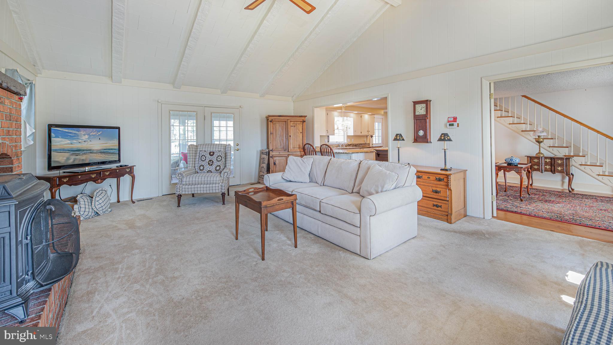 41 Lighthouse Road Selbyville, DE 19975 - Photo 7 of 35 Living room has exposed beams and ceiling fan
