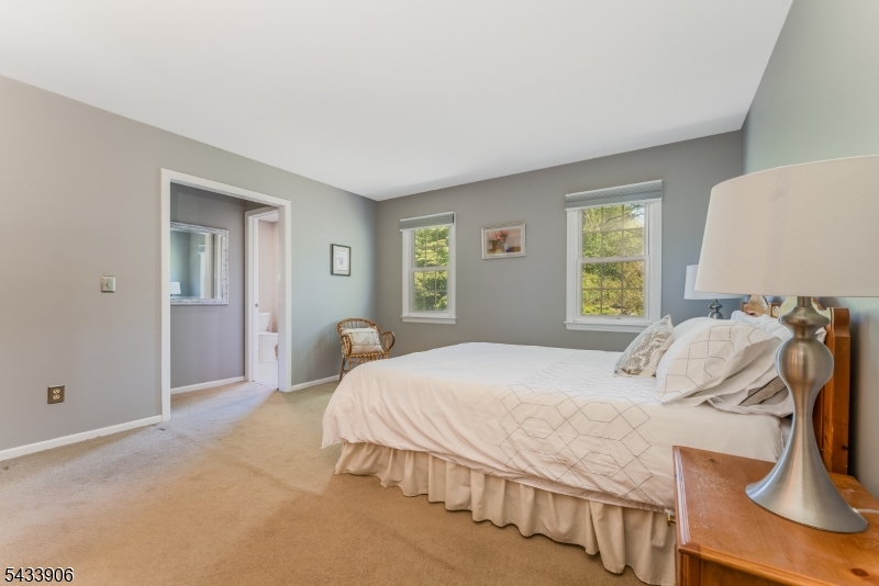 14 Lexington Road Annandale, NJ 08801 - Photo 23 of 47 a bedroom with a bed and a window