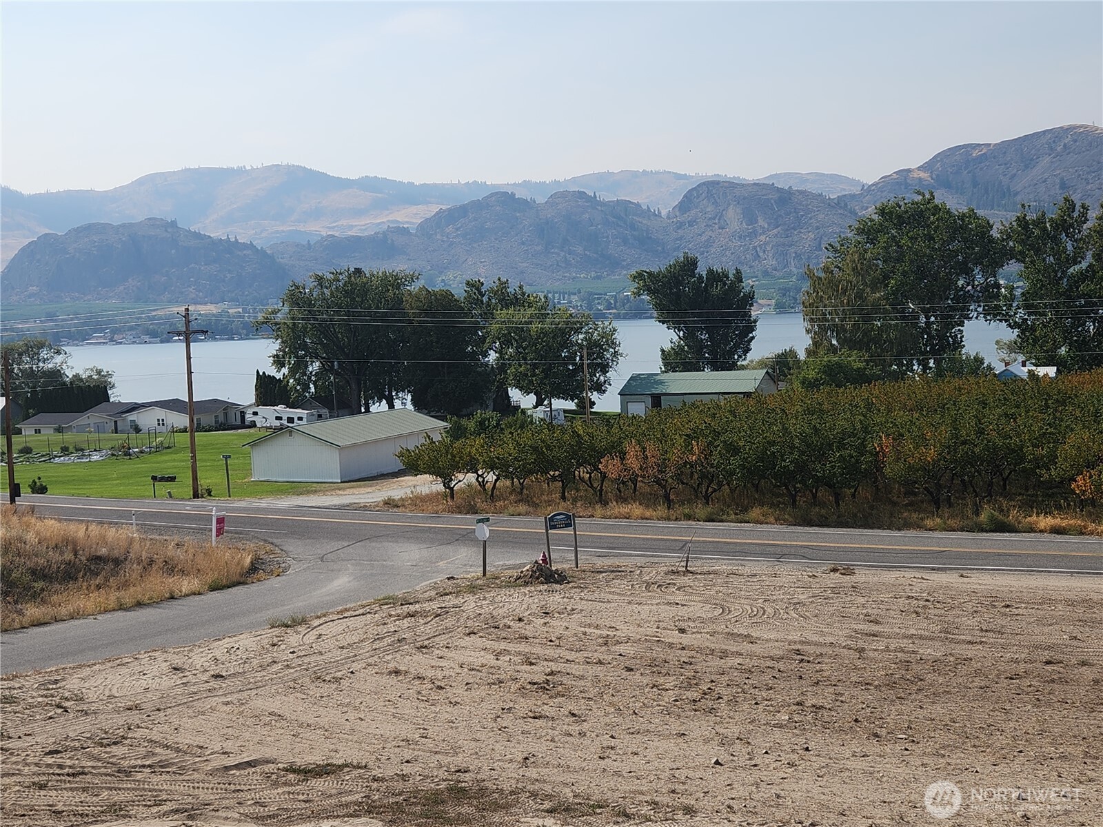 136 Eastlake Road Oroville, WA 98844 - Photo 2 of 20 a view of a road with a yard