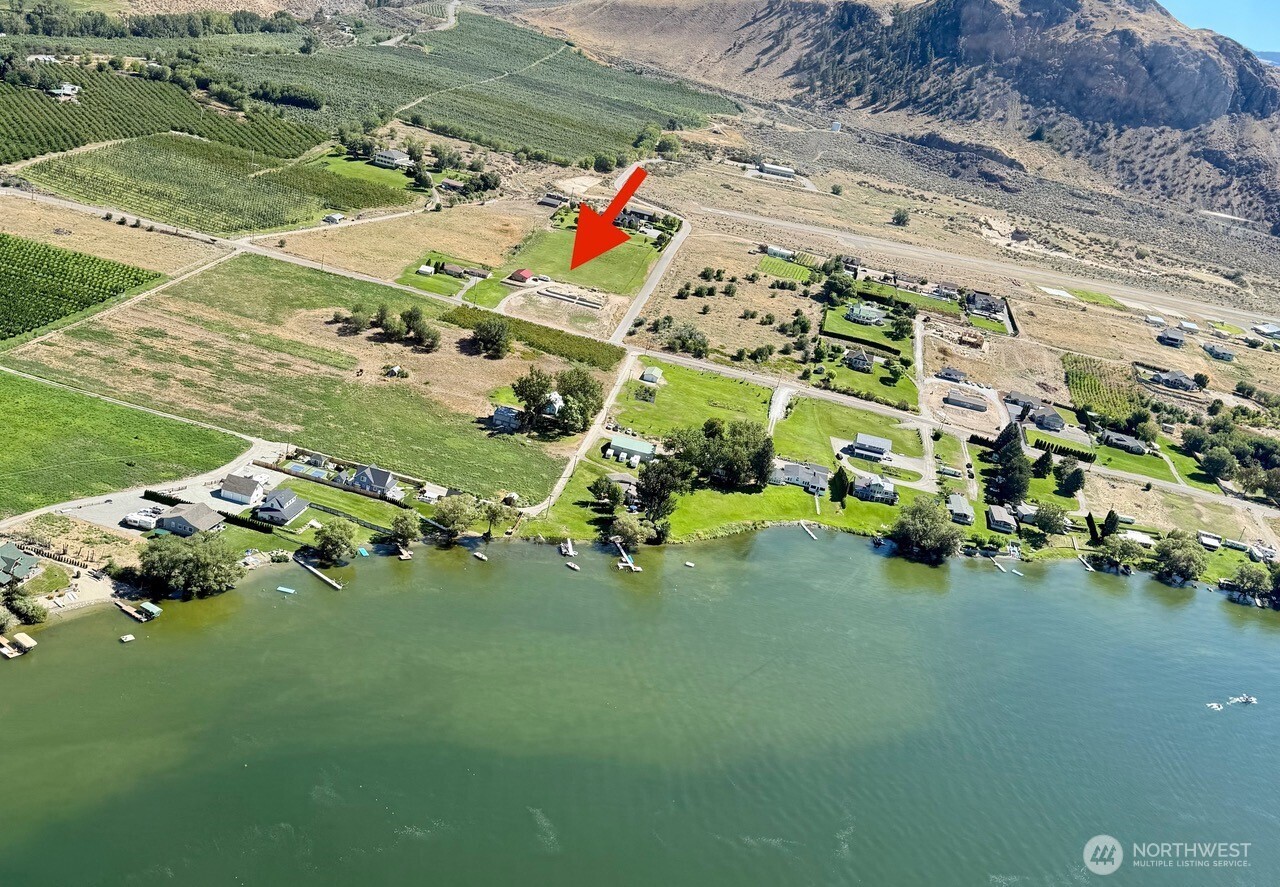136 Eastlake Road Oroville, WA 98844 - Photo 3 of 20 an aerial view of a house with a garden