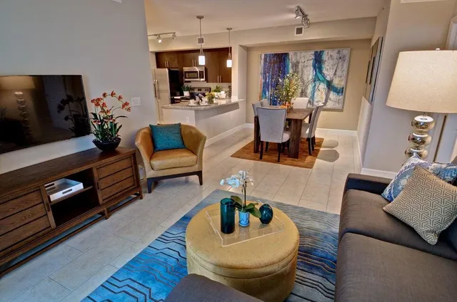 a living room with furniture and a flat screen tv