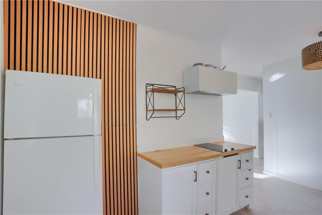 5848 Saltsburg Road Verona, PA 15147 - Photo 13 of 23 a kitchen with a refrigerator and a stove