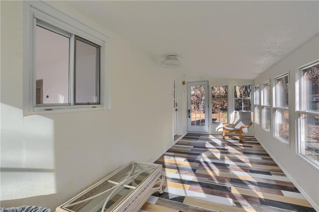 5848 Saltsburg Road Verona, PA 15147 - Photo 15 of 23 a bedroom with a bed and wooden floor