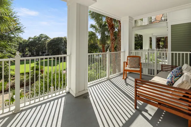 a view of a balcony with wooden floor