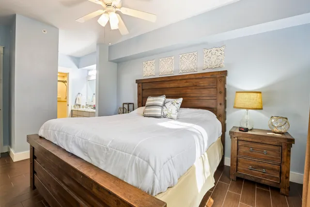 a bedroom with a bed and a chandelier